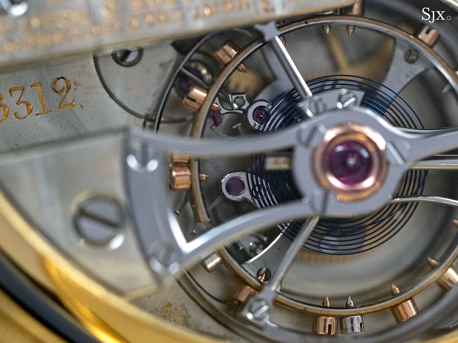 Close-up of a Patek Philippe tourbillon watch movement, showcasing intricate craftsmanship and engineering precision