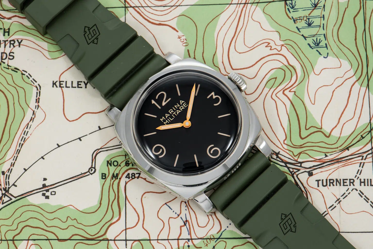Vintage-style Panerai Radiomir watch with Italian Navy heritage resting on a topographic map