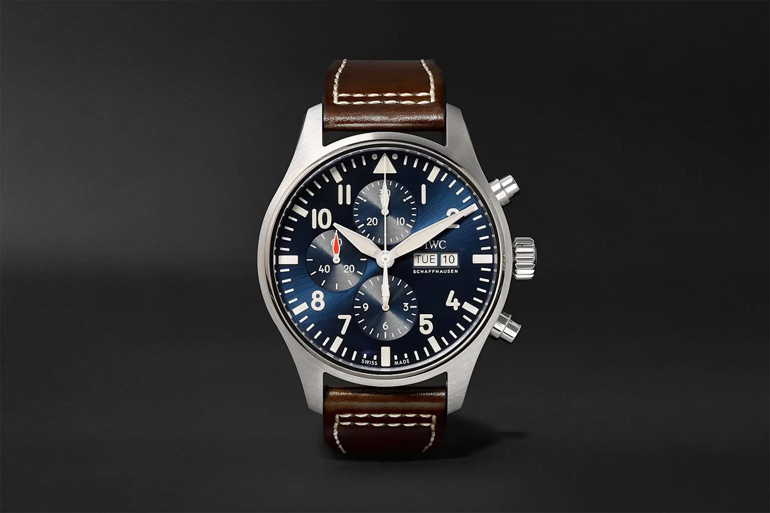 Close-up of an IWC Pilot's Watch Chronograph with a blue dial and leather strap showcasing precision and elegant pilot watch design