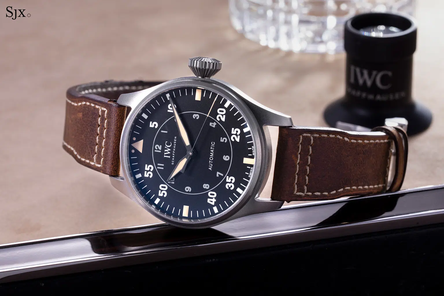 Close-up of IWC Big Pilot's Watch 43 Spitfire in titanium with leather strap, showcasing design and high-grade materials