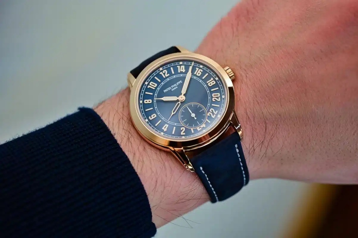 Patek Philippe Calatrava Pilot Travel Time 5524R rose gold watch with blue dial on wrist